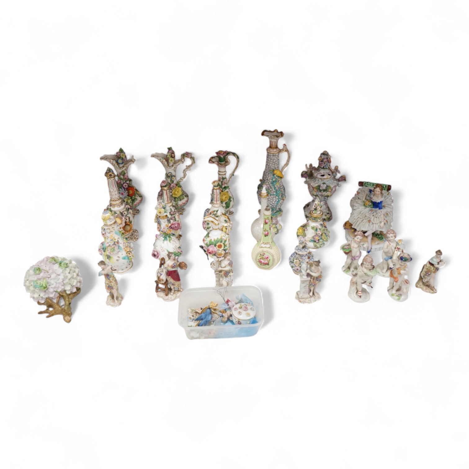 A group of English porcelain flower encrusted scent bottles and yours, Coalport, Minton etc., c.1830-50 together with Continental porcelain figures a wall pocket etc, largest 26cm high
